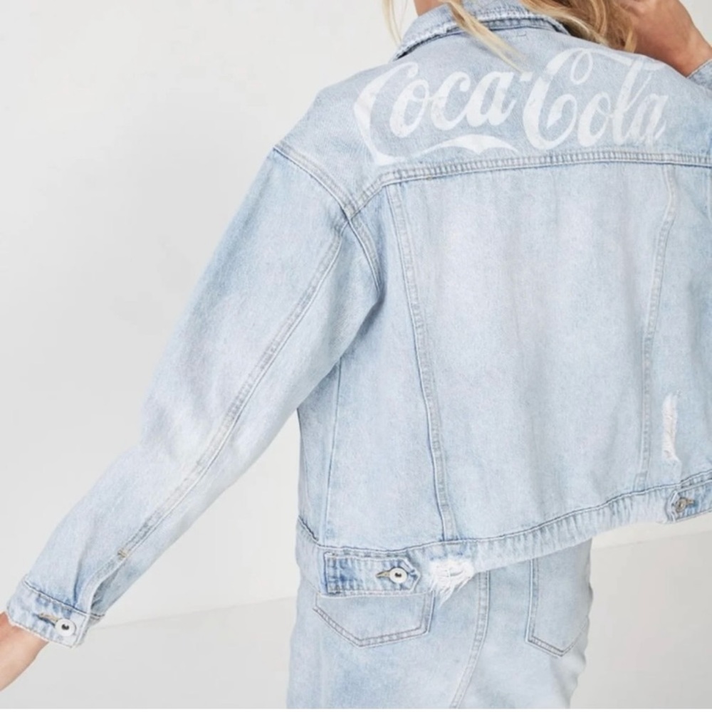 Distressed light wash denim jacket